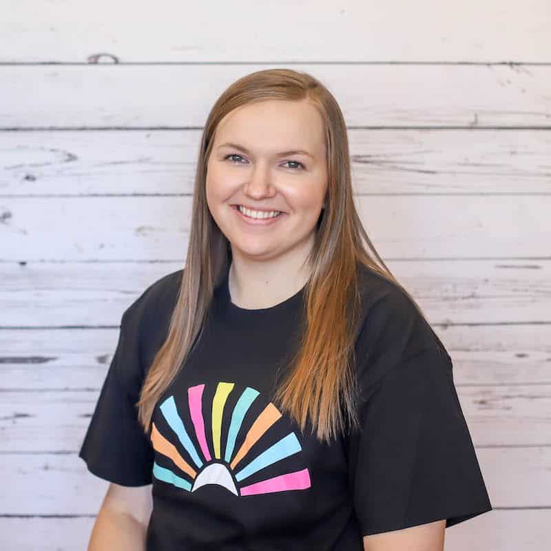 Molly Mattox 2023 headshot photo with white wood background
