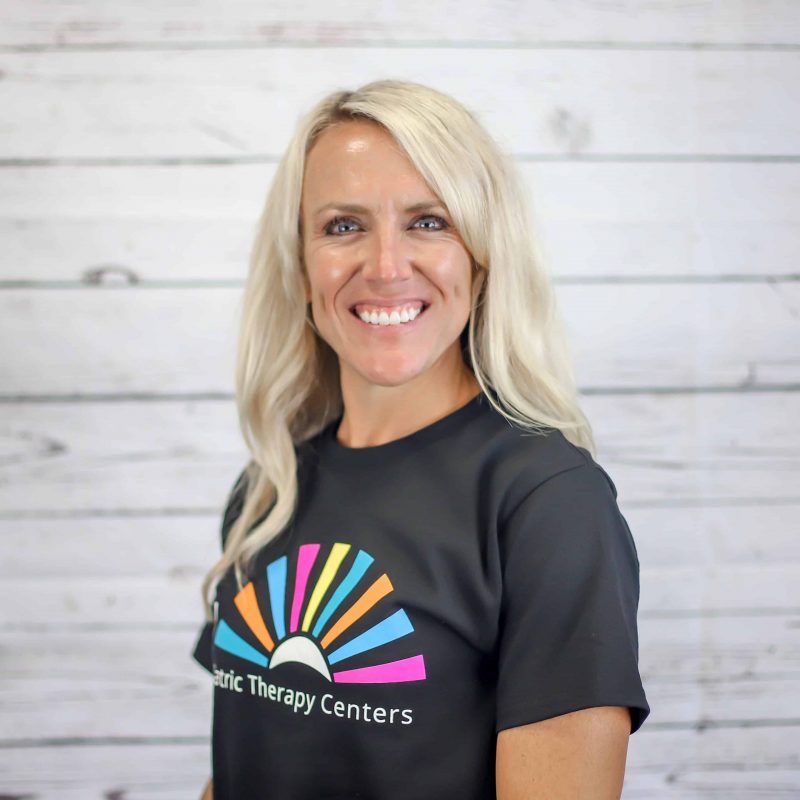 Erin Blodgett headshot photo with white wood background