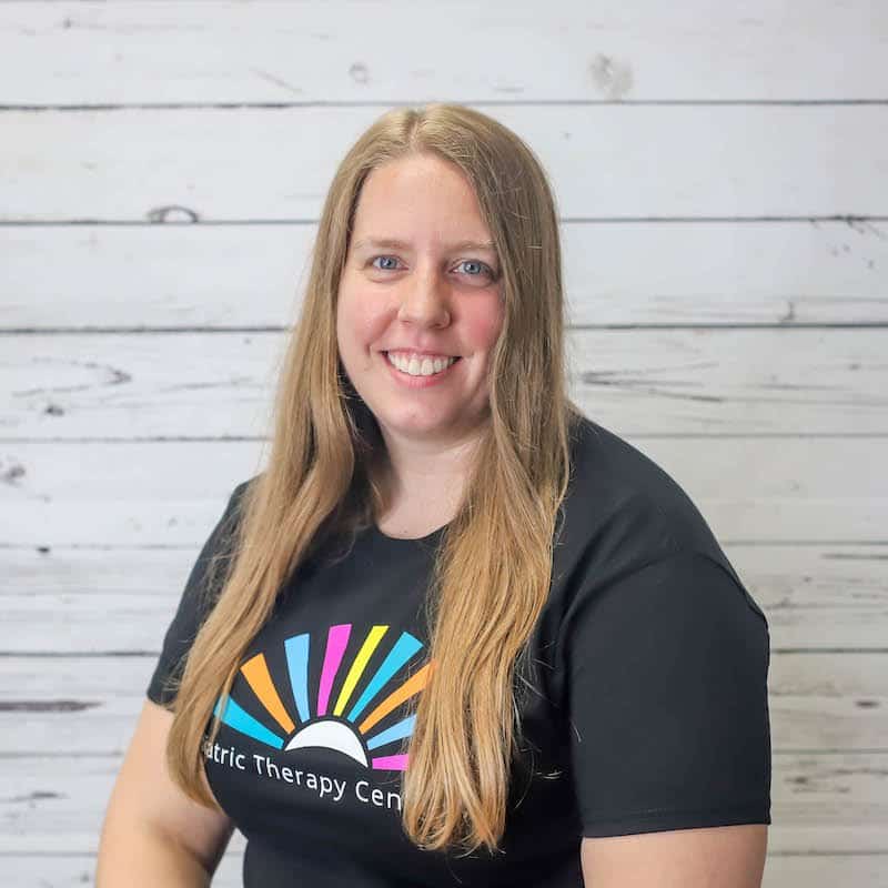 Stacy_Dettmann 2022 headshot photo with white wood background